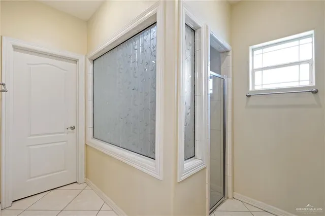 a view of walk in closet with clothes
