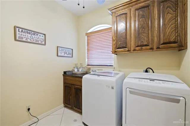 a view of a dining room with furniture a chandelier and a chandelier