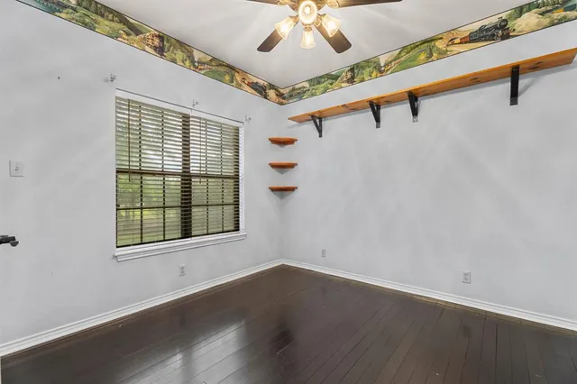 a bathroom with a granite countertop sink mirror and