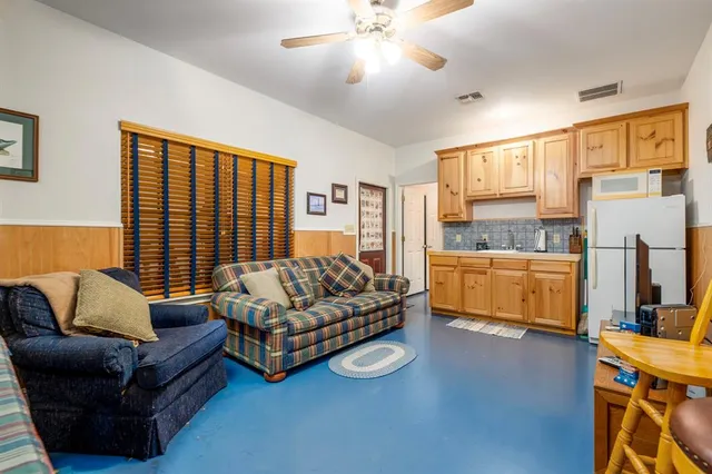 a bathroom with a toilet a sink and a mirror