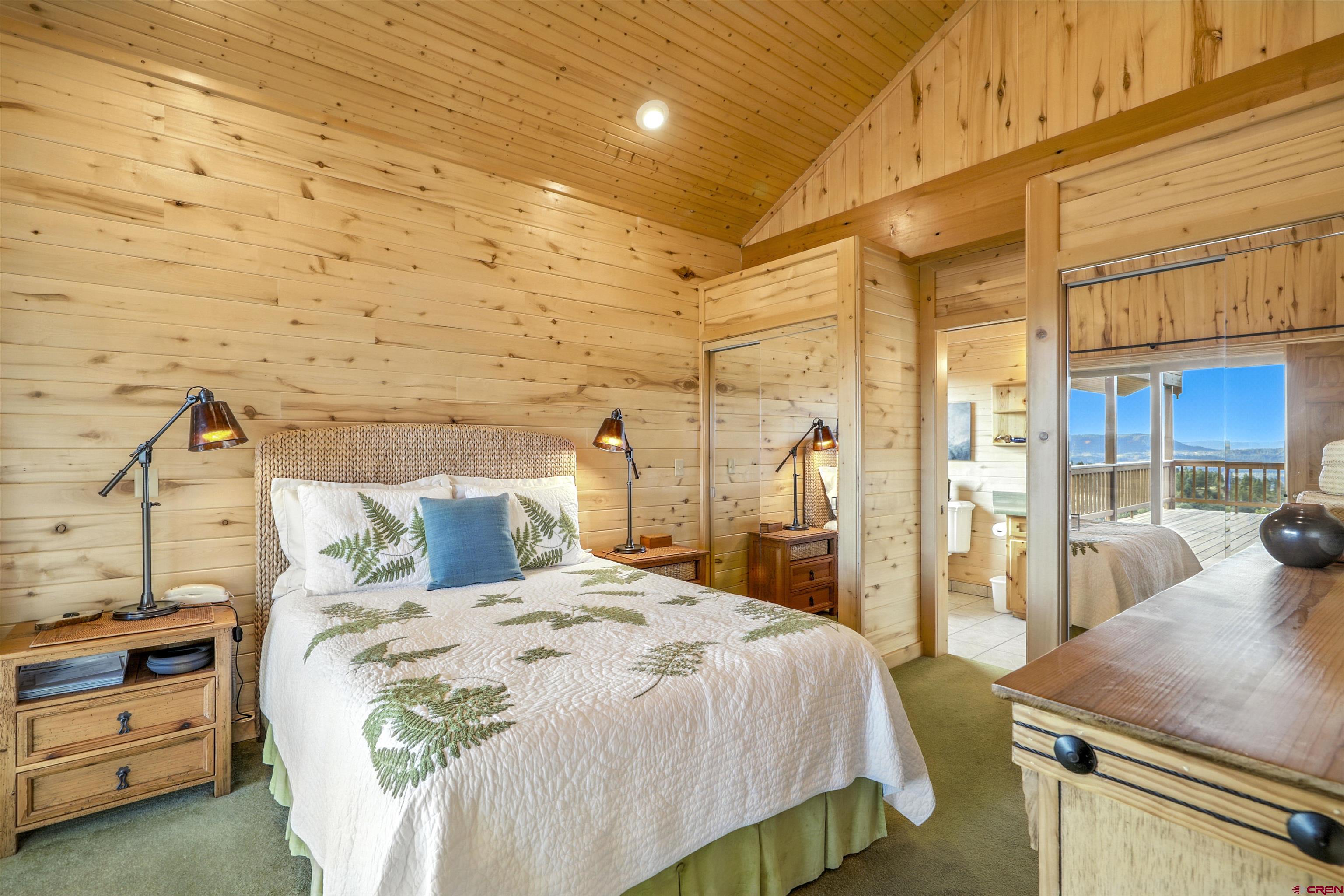 1100 Soaring Eagle Court Chromo, CO 81128 - Photo 13 of 44 a bedroom with a bed and a night stand