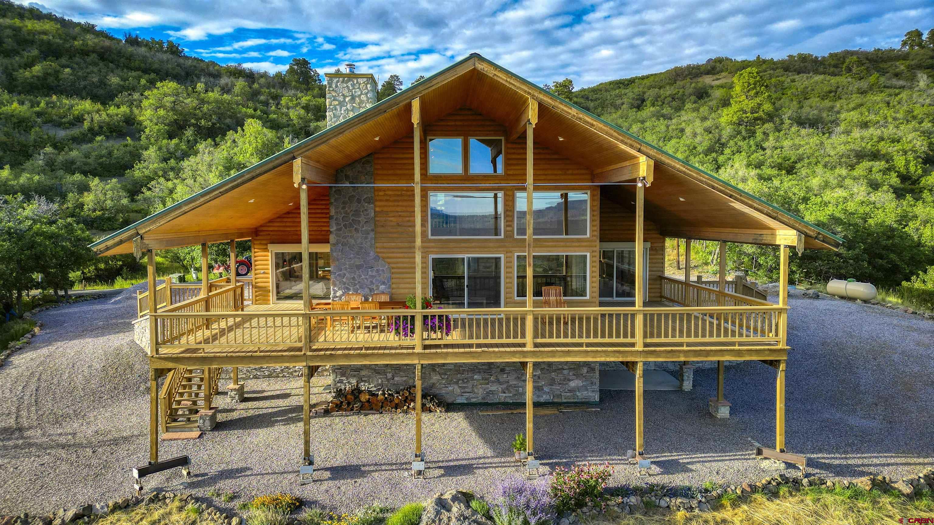 1100 Soaring Eagle Court Chromo, CO 81128 - Photo 2 of 44 a view of a house with a balcony