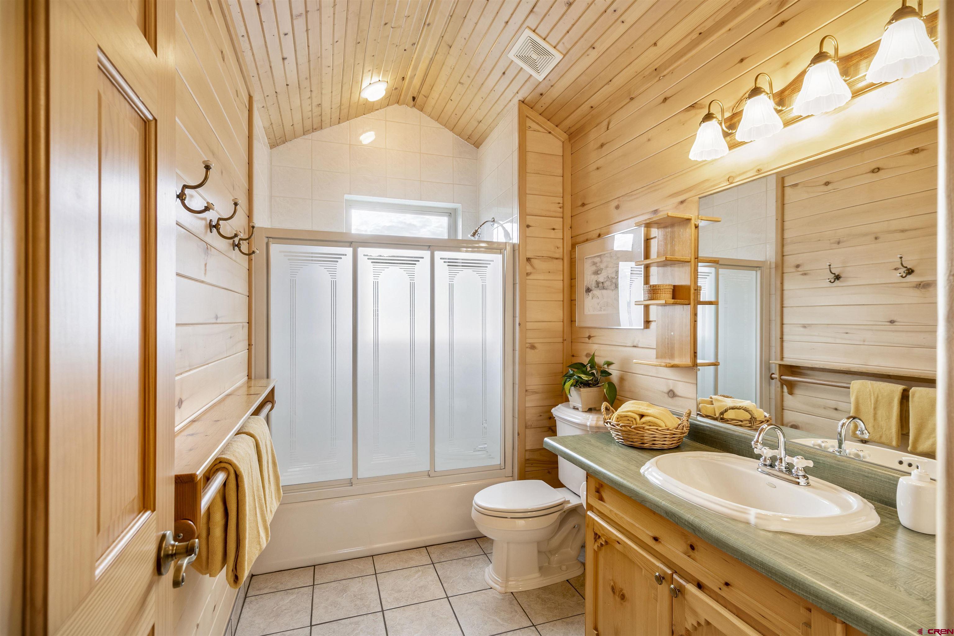 1100 Soaring Eagle Court Chromo, CO 81128 - Photo 24 of 44 a bathroom with a sink a toilet and a mirror