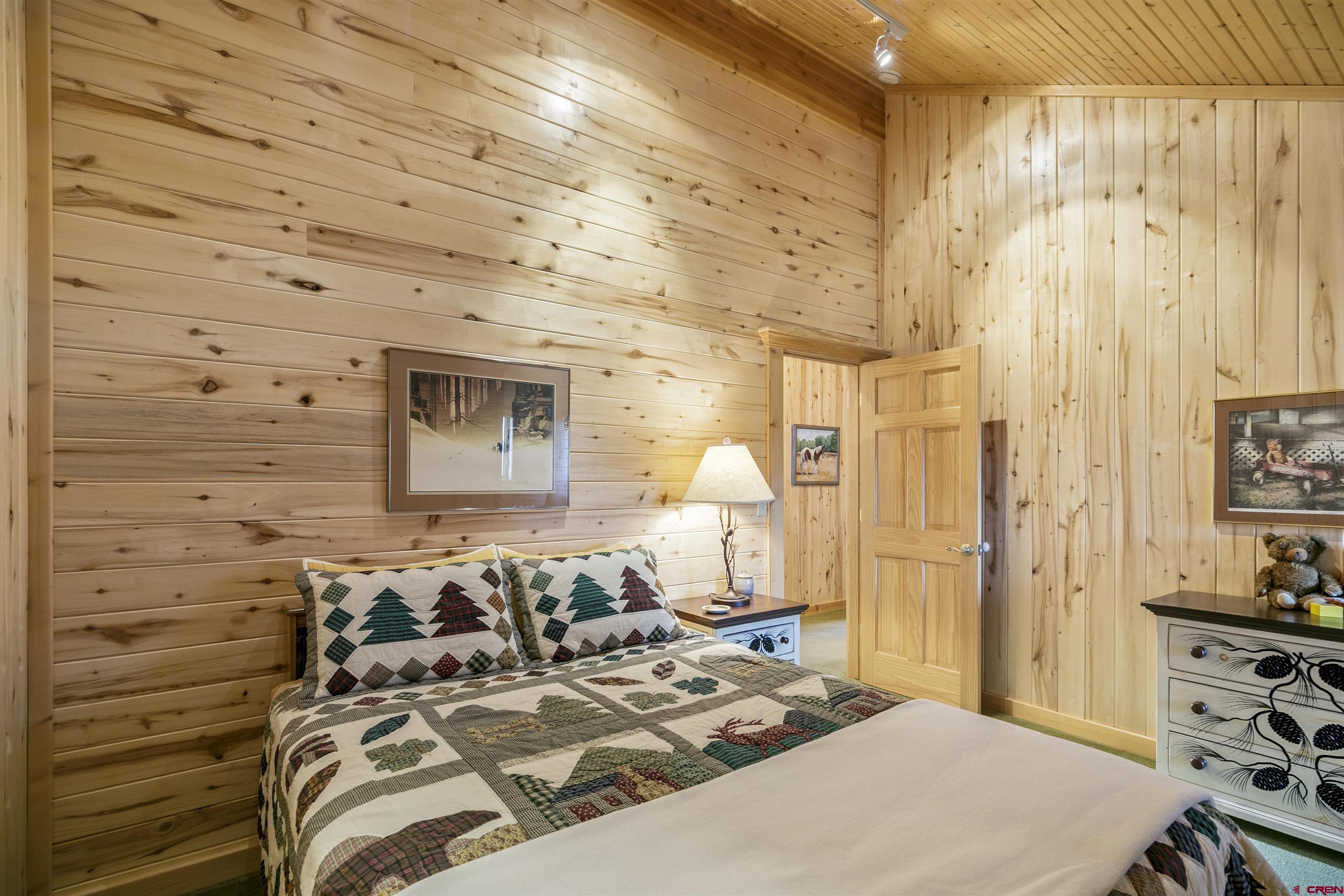 1100 Soaring Eagle Court Chromo, CO 81128 - Photo 30 of 44 a bedroom with a bed and a dresser