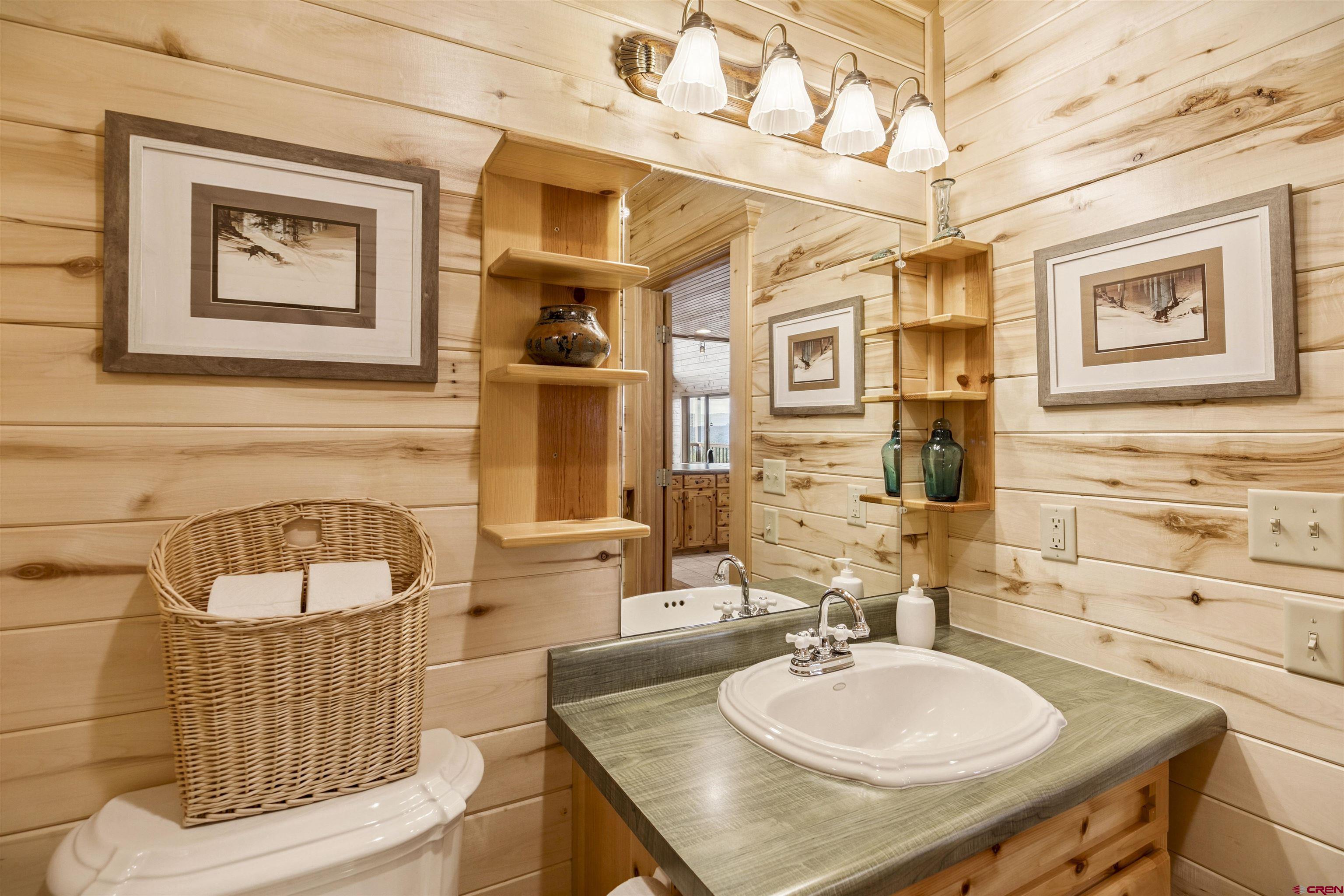 1100 Soaring Eagle Court Chromo, CO 81128 - Photo 38 of 44 a bathroom with a sink and a mirror