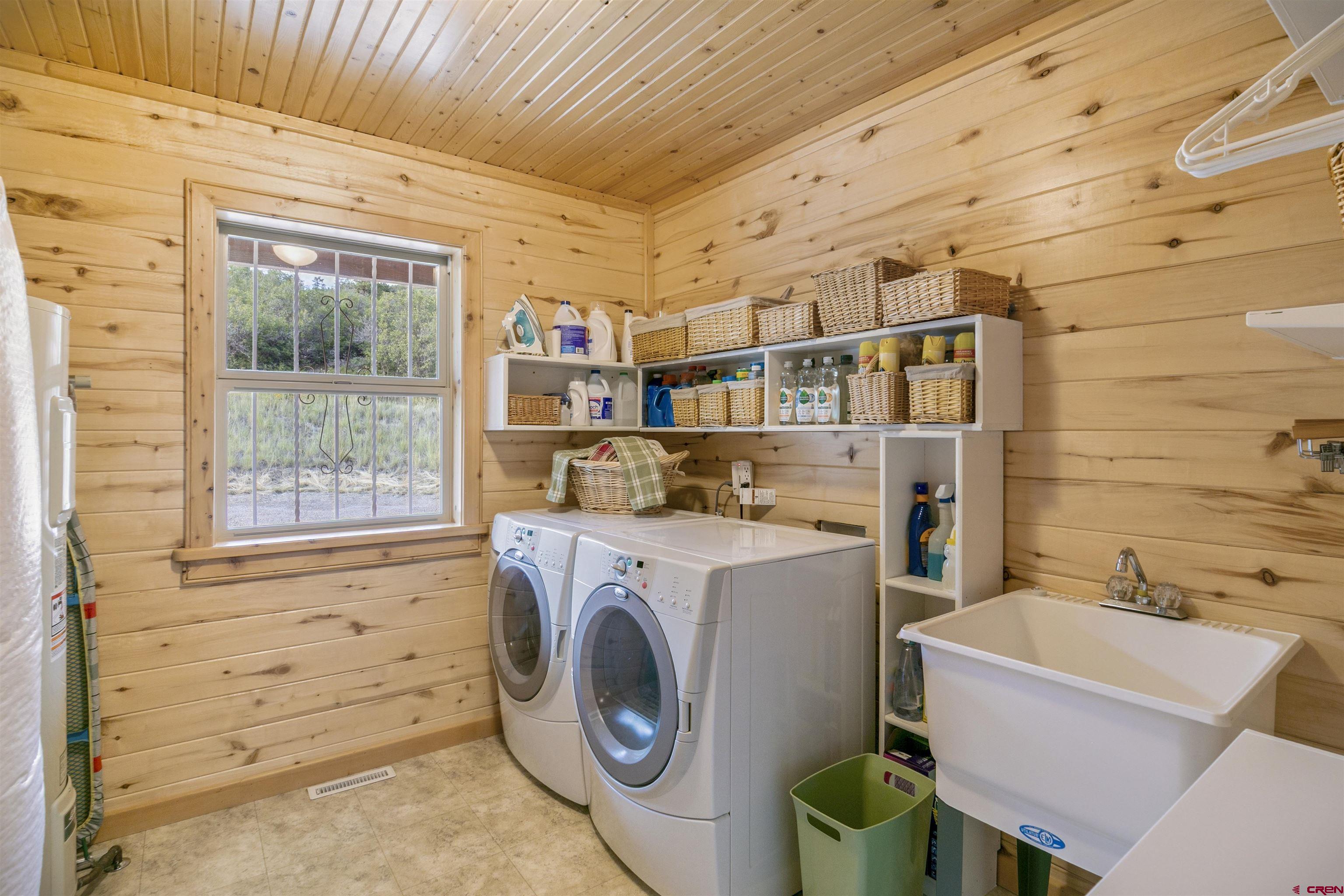 1100 Soaring Eagle Court Chromo, CO 81128 - Photo 39 of 44 a utility room with dryer and washer