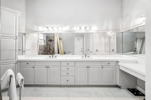 a bathroom with a double vanity sink and a mirror