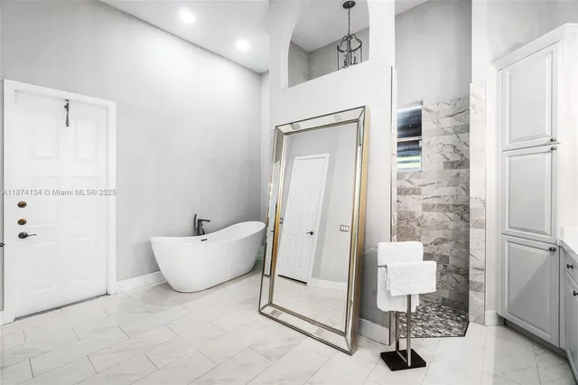a bathroom with a bathtub and shower
