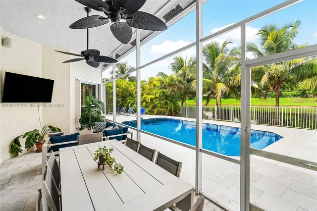 a view of living room with furniture and a flat screen tv