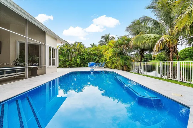 a view of a swimming pool with a patio