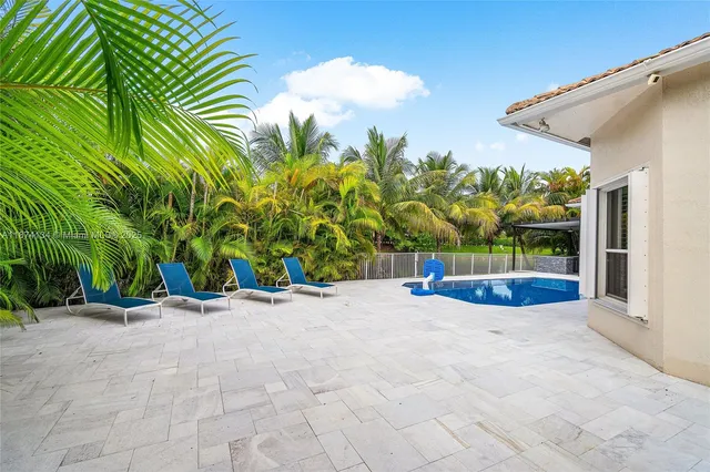 a view of a back yard of the house