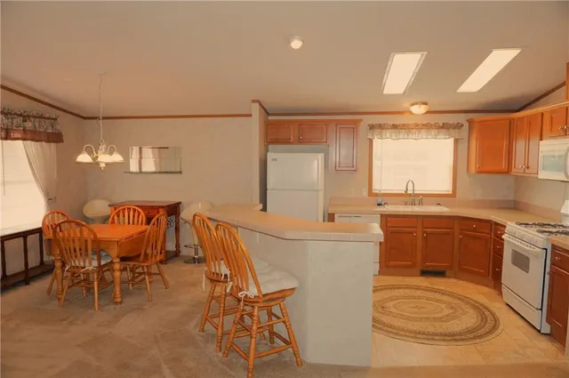 a kitchen with granite countertop furniture and a dining table