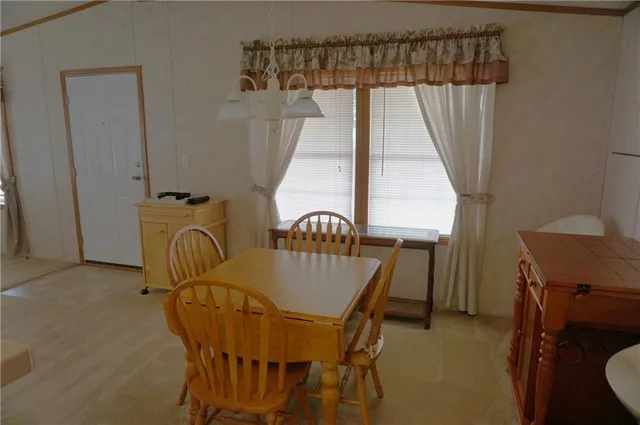 a balcony with table and chairs