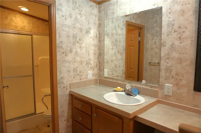a bathroom with a sink and a mirror