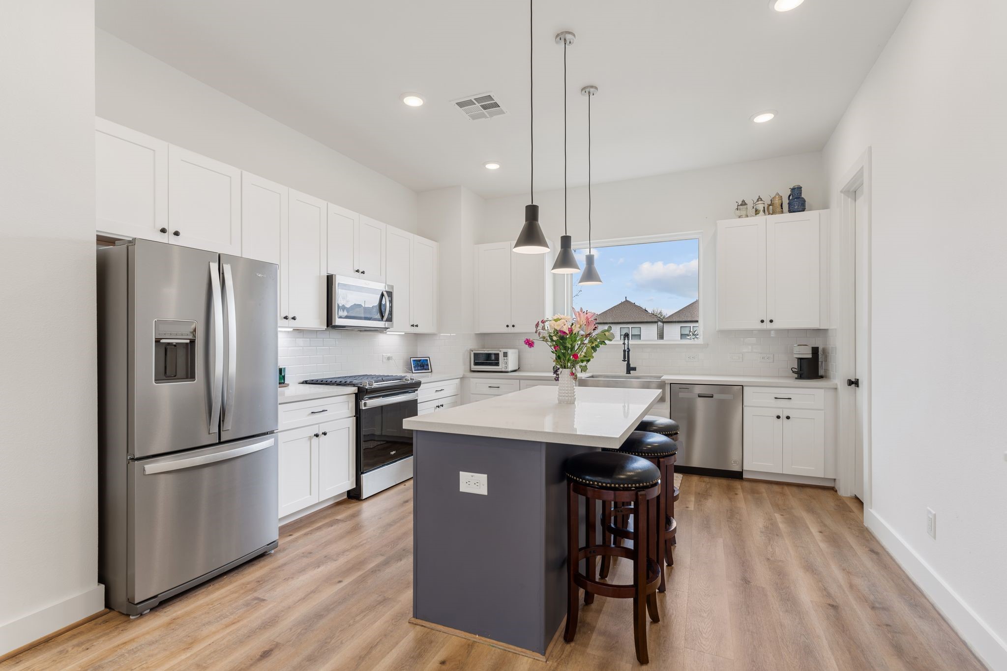 4862 Brinkman Street Houston, TX 77018 - Photo 3 of 33 Light-filled, upgraded kitchen featuring thoughtful finishes and plenty of space for cooking and gathering.
