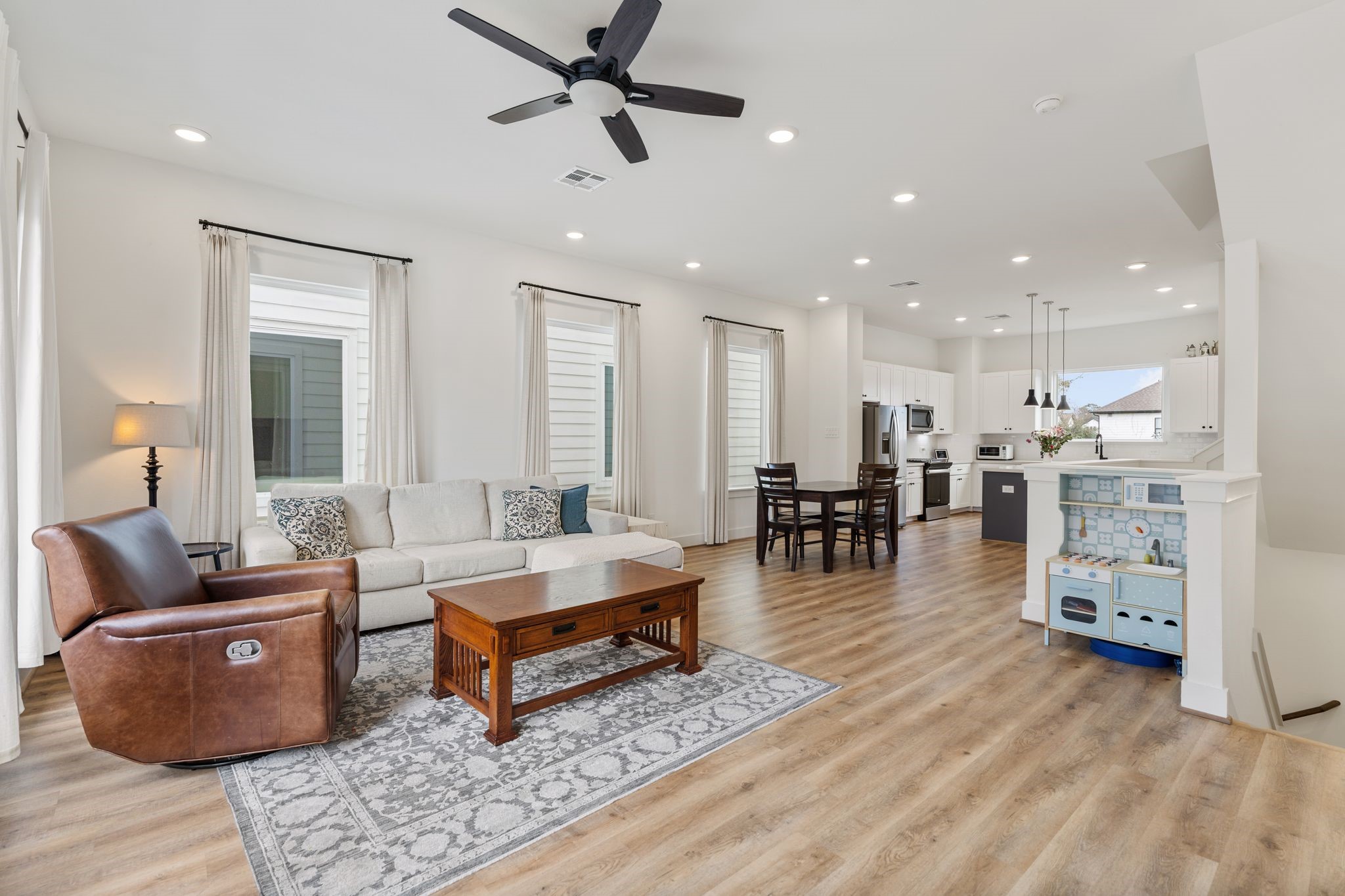 4862 Brinkman Street Houston, TX 77018 - Photo 9 of 33 Bright and inviting living level with an open flow and a balcony that extends the space outdoors.