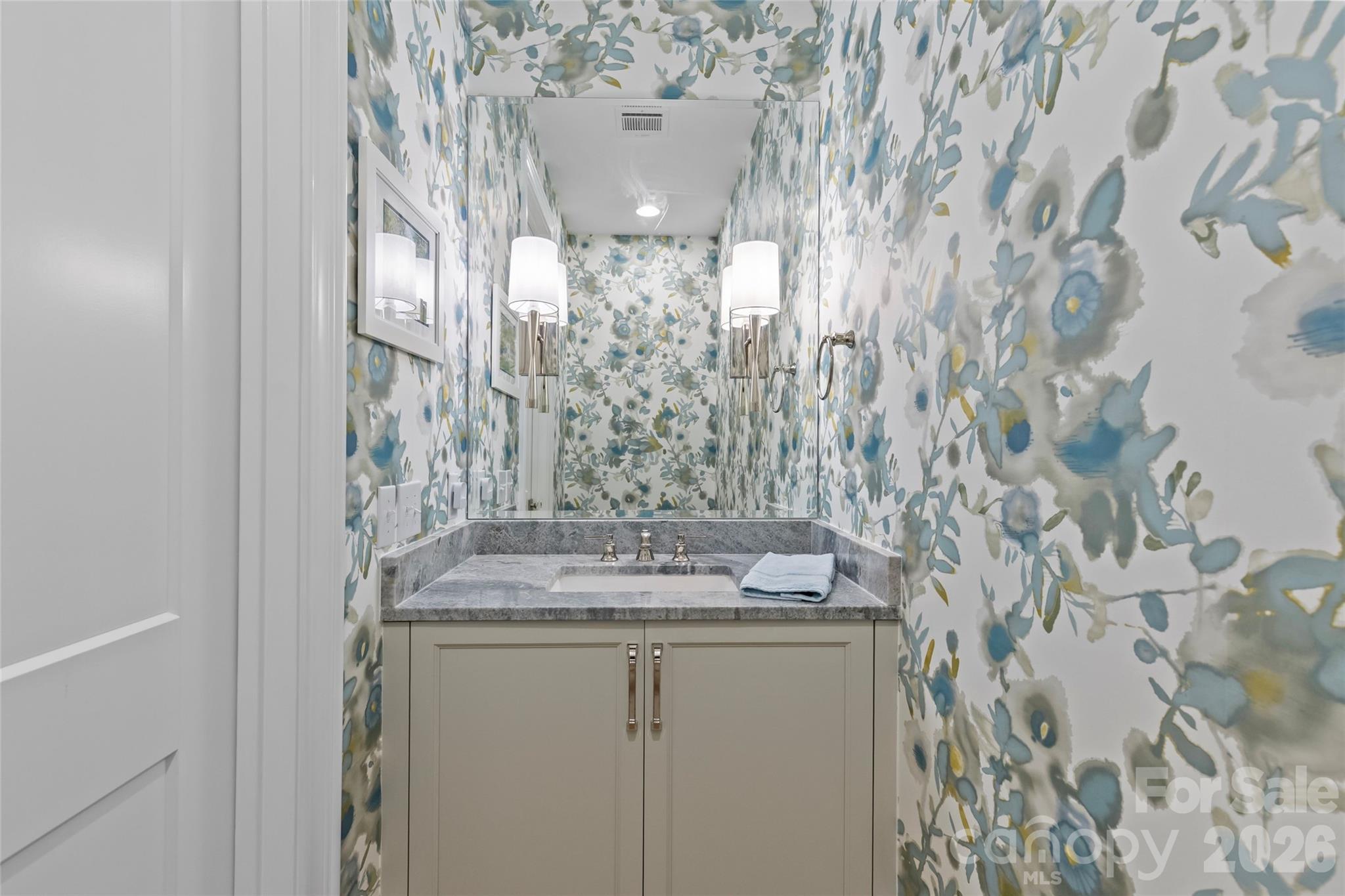 1500 Queens Road, Unit 104 Charlotte, NC 28207 - Photo 16 of 41 a bathroom with a granite countertop sink and a mirror
