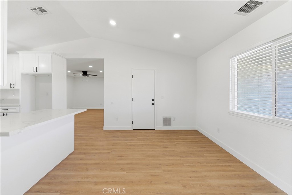 22557 Ojai Road Apple Valley, CA 92308 - Photo 20 of 57 a view of an empty room with a window