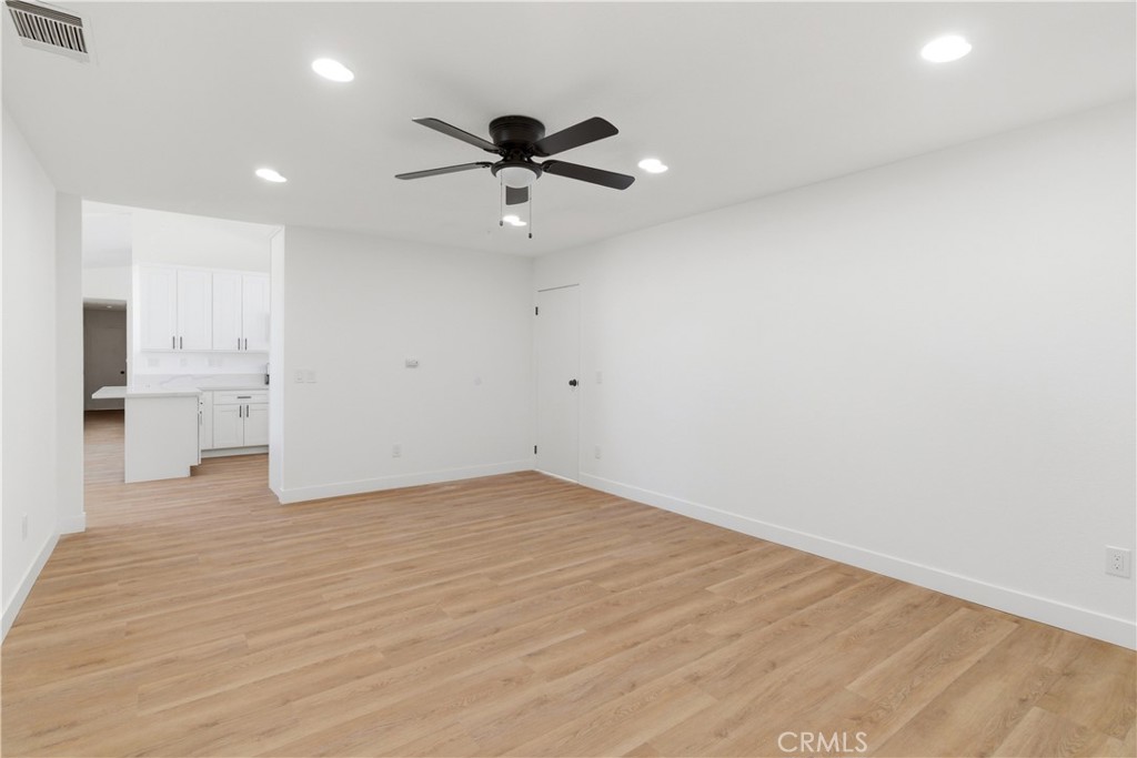 22557 Ojai Road Apple Valley, CA 92308 - Photo 21 of 57 a view of a livingroom with a ceiling fan and window