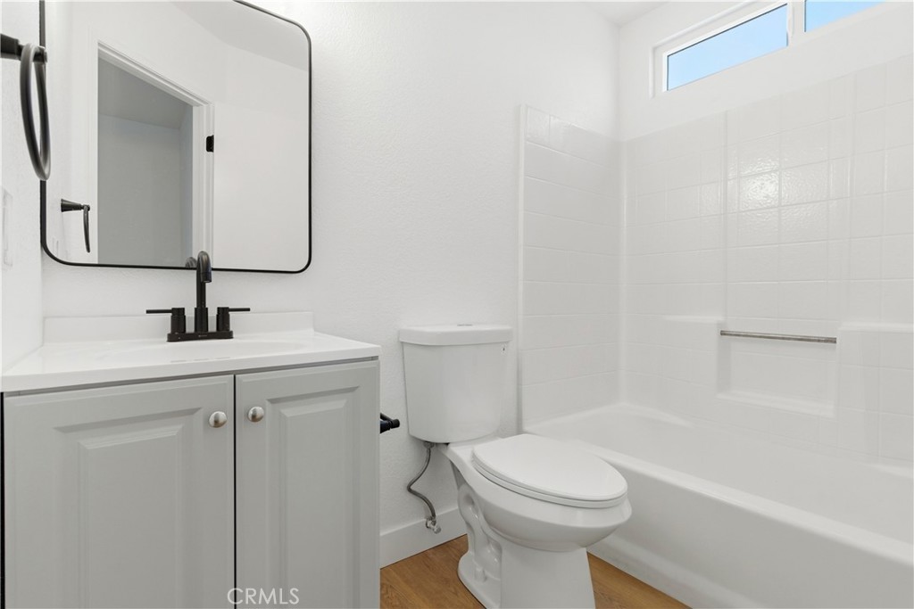 22557 Ojai Road Apple Valley, CA 92308 - Photo 35 of 57 a bathroom with a sink a toilet and shower