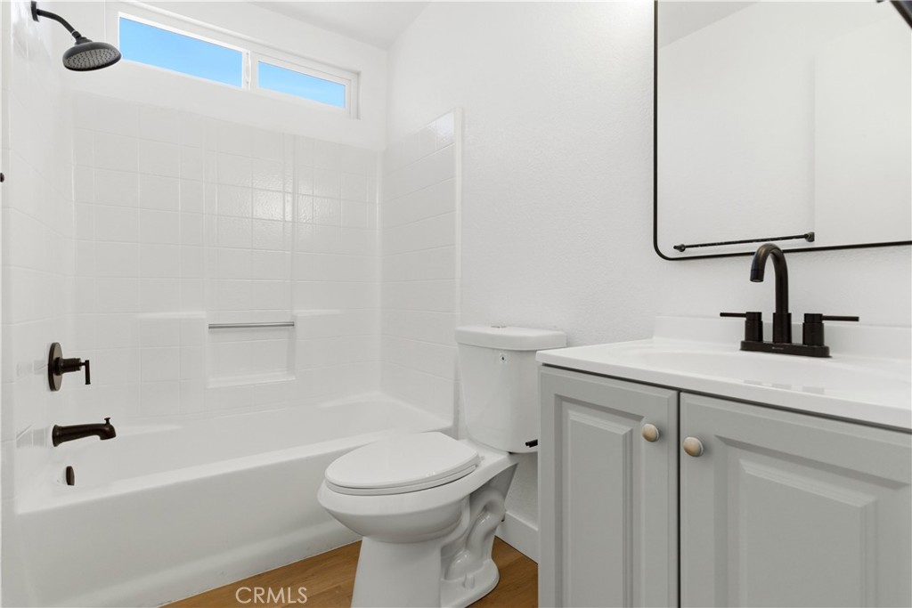 22557 Ojai Road Apple Valley, CA 92308 - Photo 36 of 57 a bathroom with a sink a toilet and shower