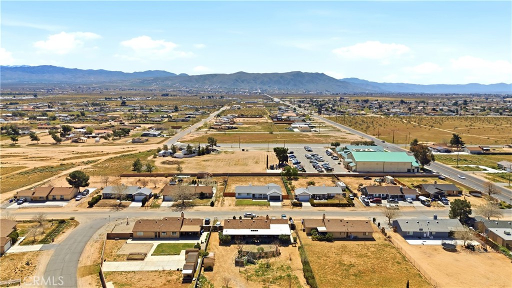 22557 Ojai Road Apple Valley, CA 92308 - Photo 48 of 57 an aerial view of residential houses with outdoor space