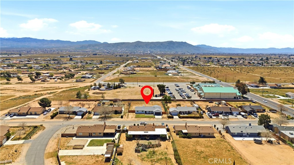 22557 Ojai Road Apple Valley, CA 92308 - Photo 49 of 57 an aerial view of residential houses and outdoor space