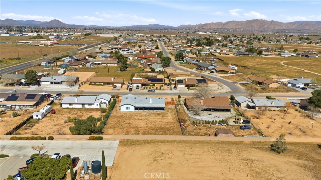 22557 Ojai Road Apple Valley, CA 92308 - Photo 52 of 57 an aerial view of residential houses with outdoor space