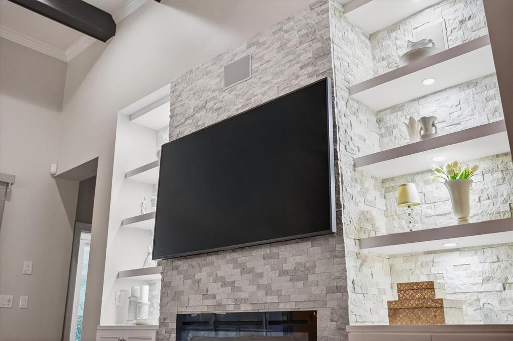 6609 Current Drive Apollo Beach, FL 33572 - Photo 14 of 47 a living room with a fireplace and a flat screen tv