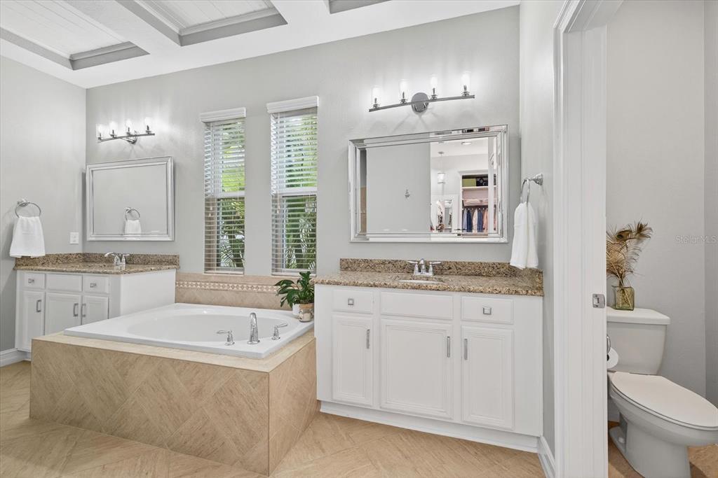 6609 Current Drive Apollo Beach, FL 33572 - Photo 25 of 47 a bathroom with a tub sink and mirror
