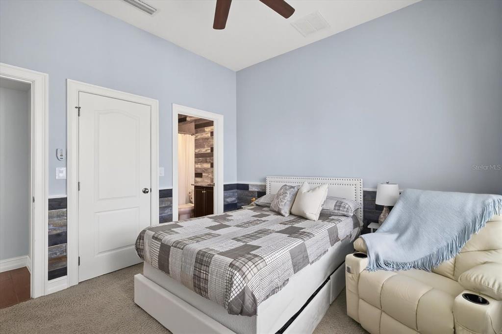 6609 Current Drive Apollo Beach, FL 33572 - Photo 34 of 47 a bedroom with a bed and a couch