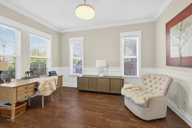 a living room with furniture and windows