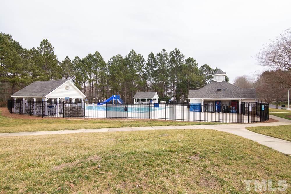 874 Seastone Street Raleigh, NC 27603 - Photo 29 of 30 a house with swimming pool in front of it
