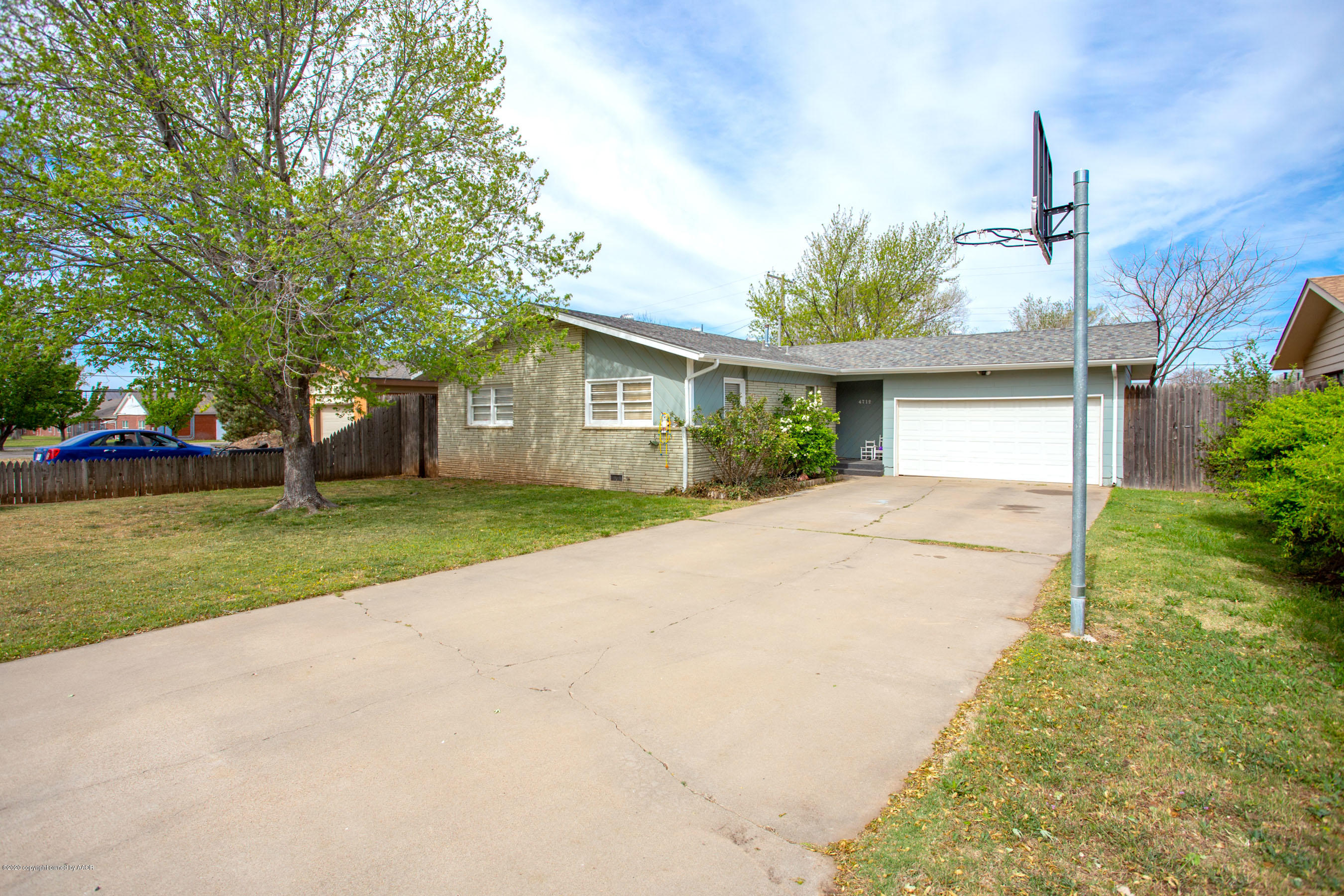4712 South Milam Street Amarillo, TX 79110 - Photo 1 of 22 a front view of house with yard and green space