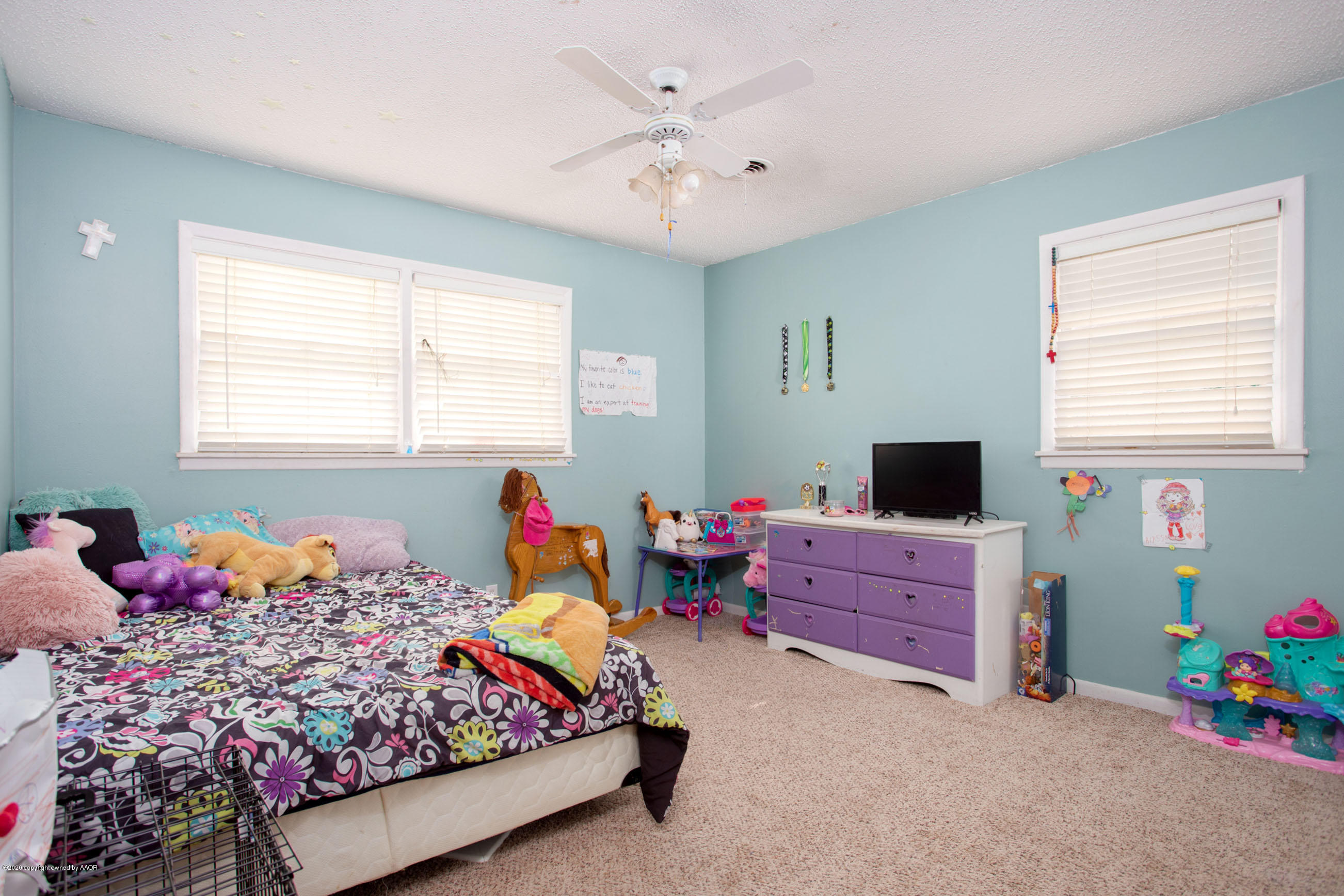 4712 South Milam Street Amarillo, TX 79110 - Photo 14 of 22 a bedroom with a bed and a window