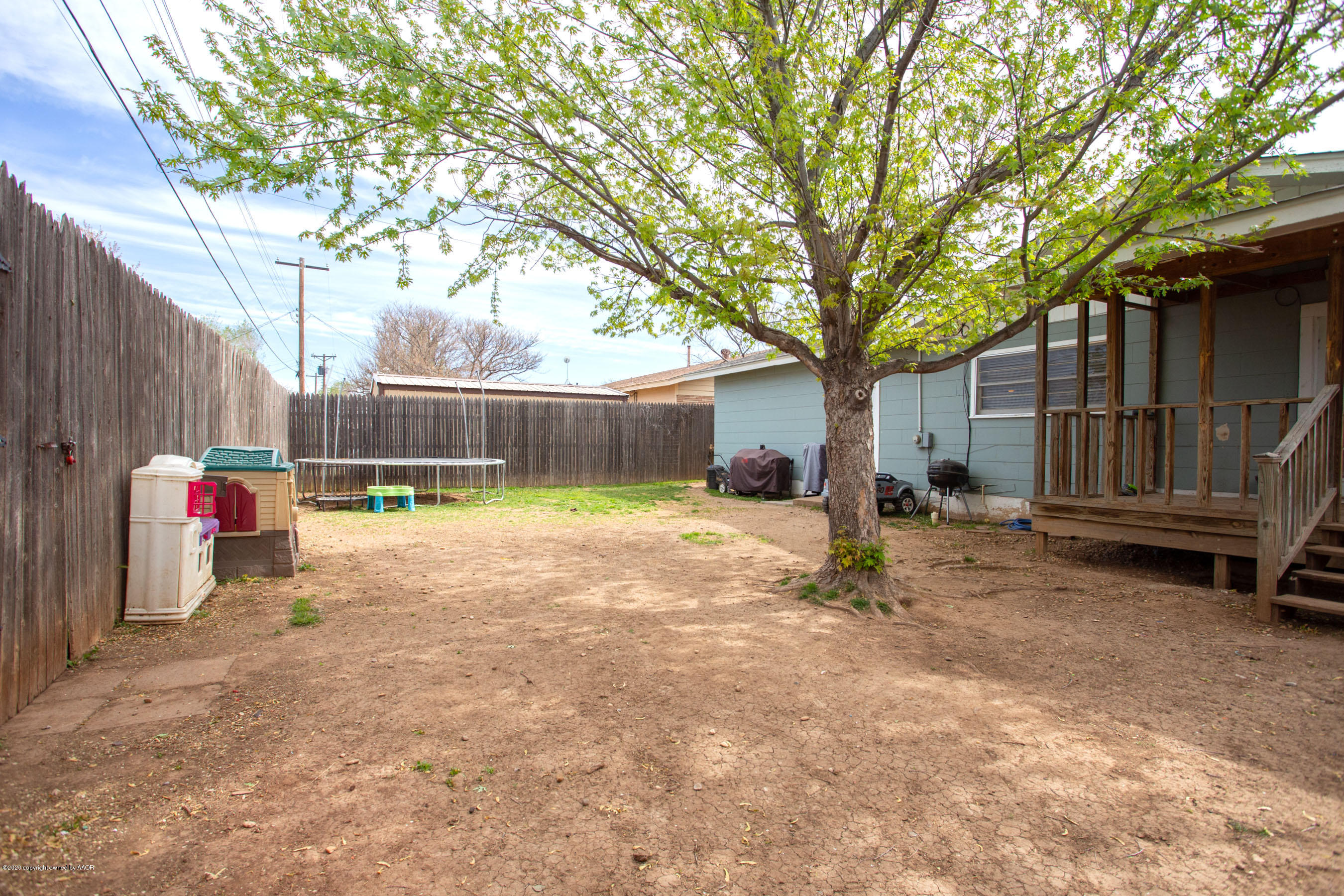 4712 South Milam Street Amarillo, TX 79110 - Photo 22 of 22 a view of a small yard in front of a house with wooden fence