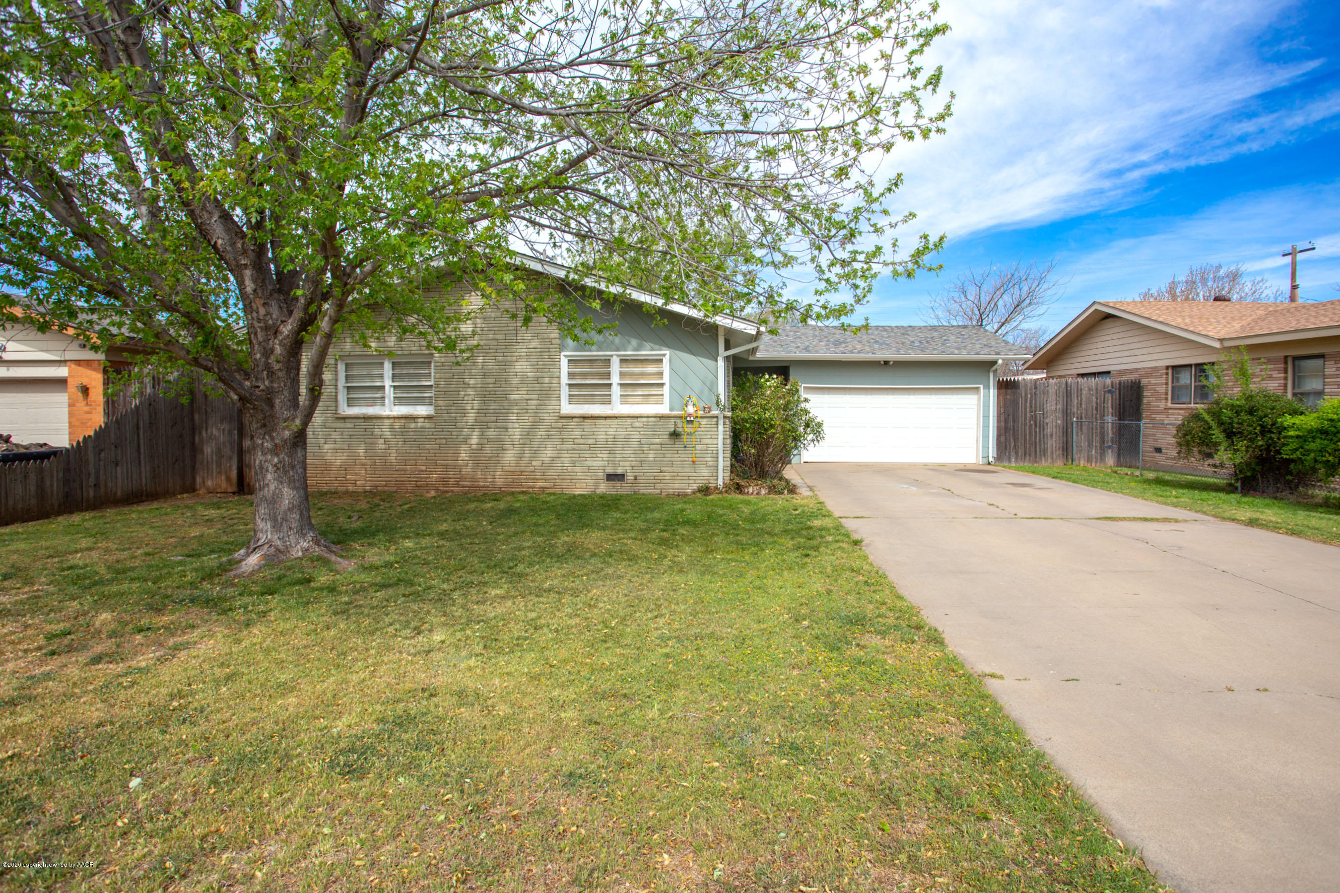 4712 South Milam Street Amarillo, TX 79110 - Photo 3 of 22 a view of backyard of house with green space