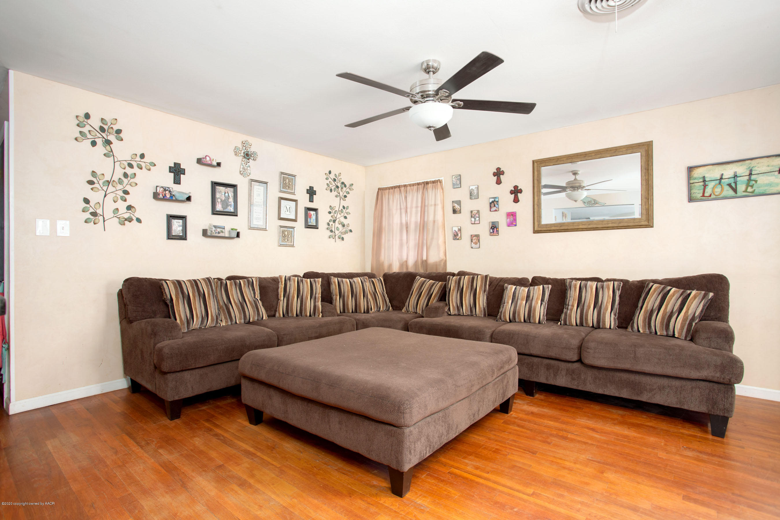 4712 South Milam Street Amarillo, TX 79110 - Photo 8 of 22 a living room with a large window and a rug