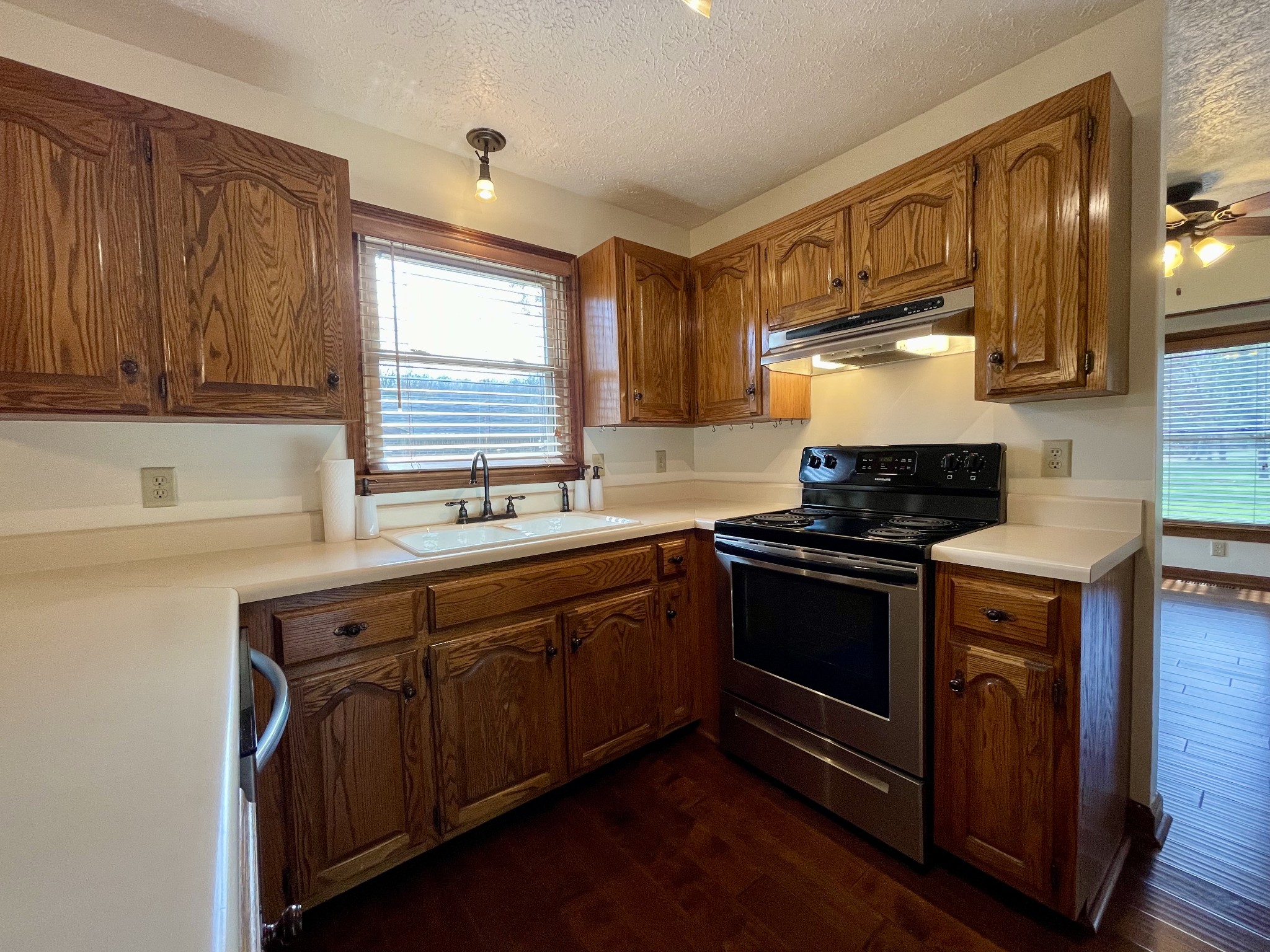 2911 New Hope Road Hendersonville, TN 37075 - Photo 12 of 27 a kitchen with stainless steel appliances granite countertop wooden cabinets stove top oven and sink