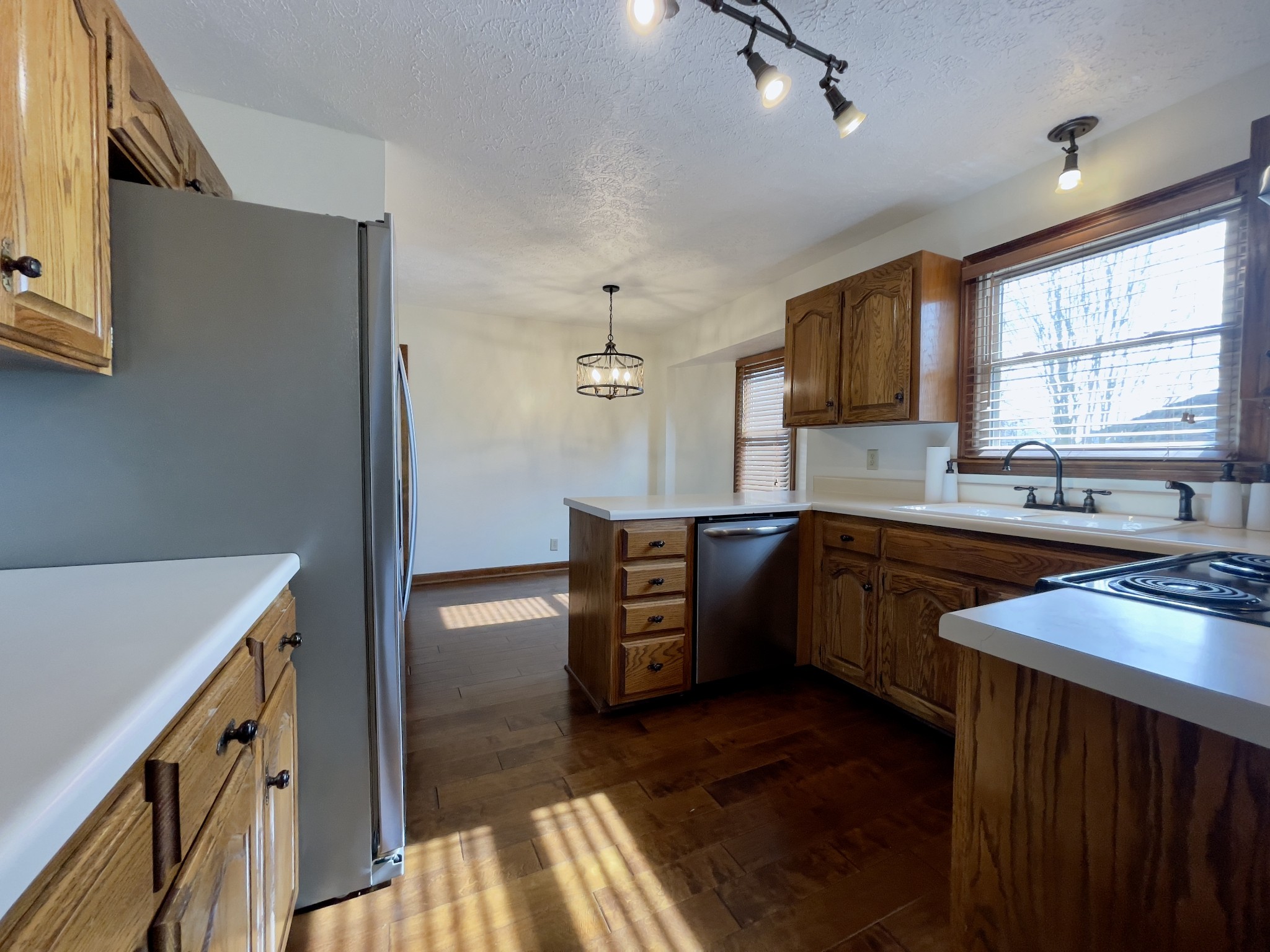 2911 New Hope Road Hendersonville, TN 37075 - Photo 13 of 27 a kitchen with stainless steel appliances granite countertop a sink stove and refrigerator