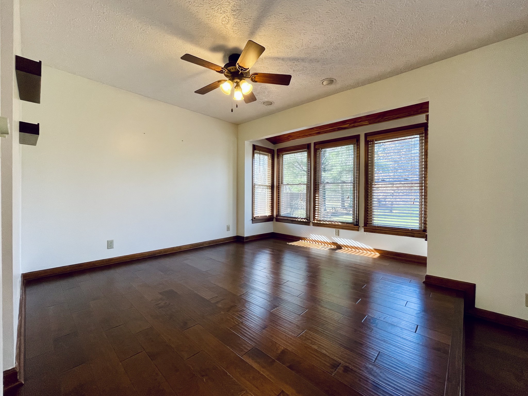 2911 New Hope Road Hendersonville, TN 37075 - Photo 8 of 27 a view of an empty room with wooden floor and a window