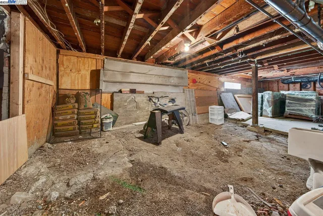 a backyard of a house with sitting area and potted plants
