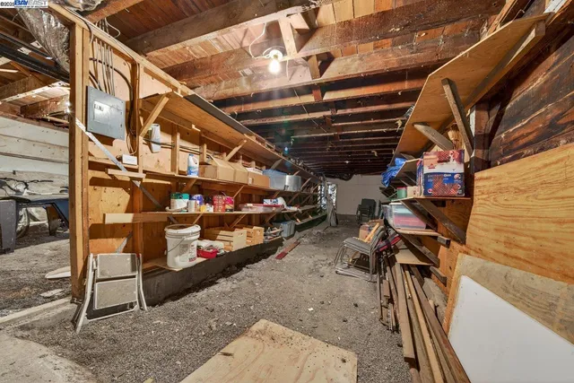 a view of parking garage with cars and other equipment