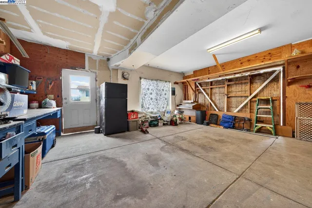 a backyard of a house with large trees