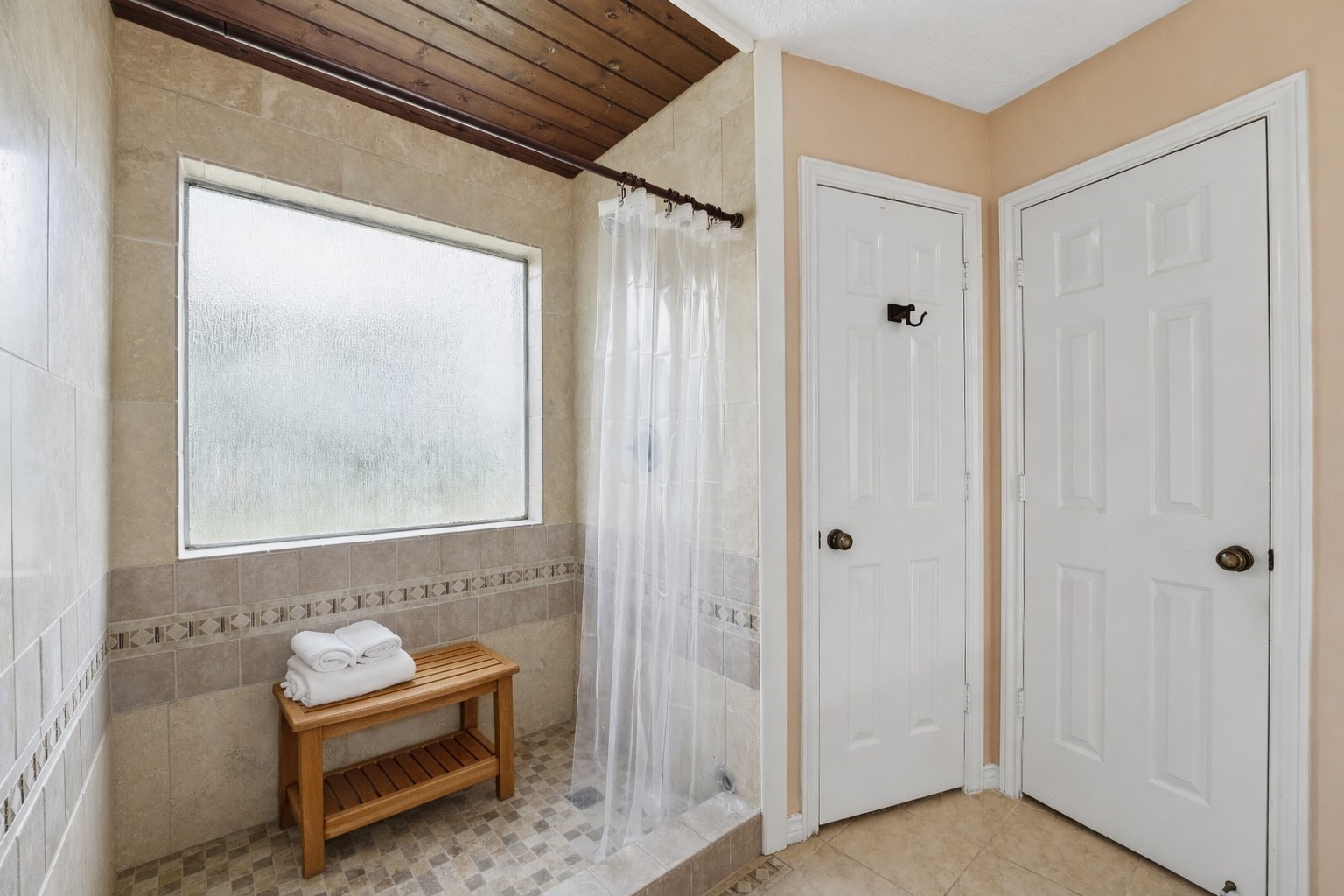 22338 Wetherburn Lane Katy, TX 77449 - Photo 14 of 36 Spacious tiled shower featuring a glass window for natural light.