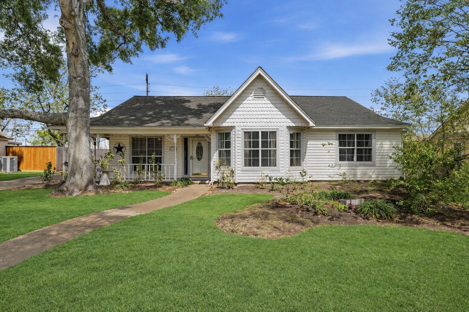 22338 Wetherburn Lane Katy, TX 77449 - Photo 2 of 36 Paved walkway leading to the front porch entrance, creating a cozy and inviting space to greet your guests. Hooks located on front porch to bring your swing!