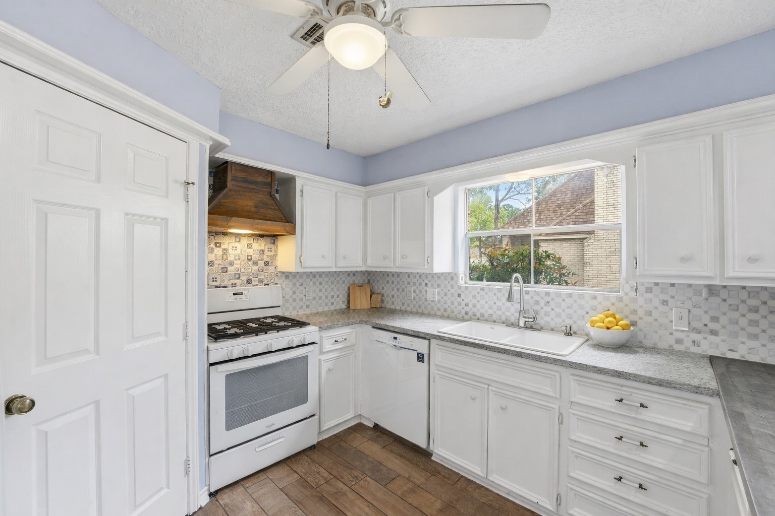 22338 Wetherburn Lane Katy, TX 77449 - Photo 8 of 36 Functional layout with plenty of space for the chef. Enjoy the view outside while creating meals in the kitchen. Appliances convey if desired.