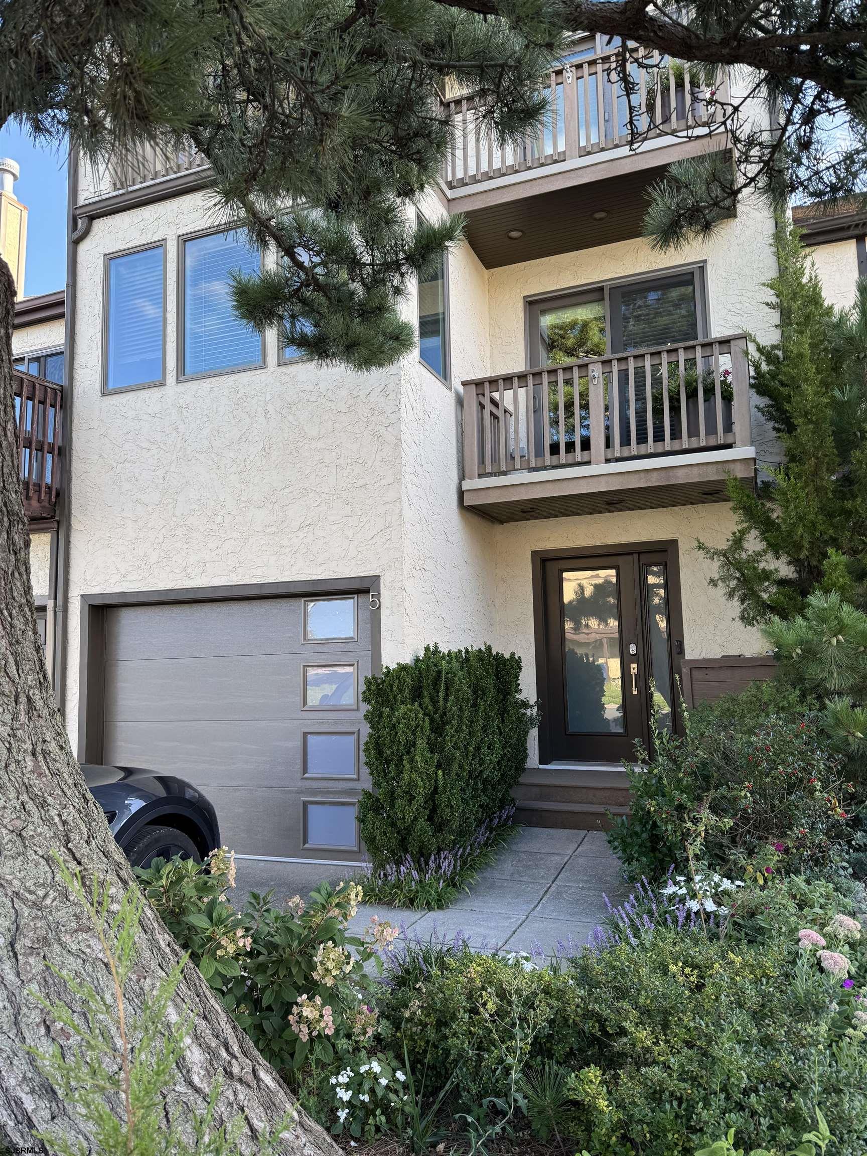 5 Beacon Lane Brigantine, NJ 08203 - Photo 1 of 39 front view of a house with a small yard