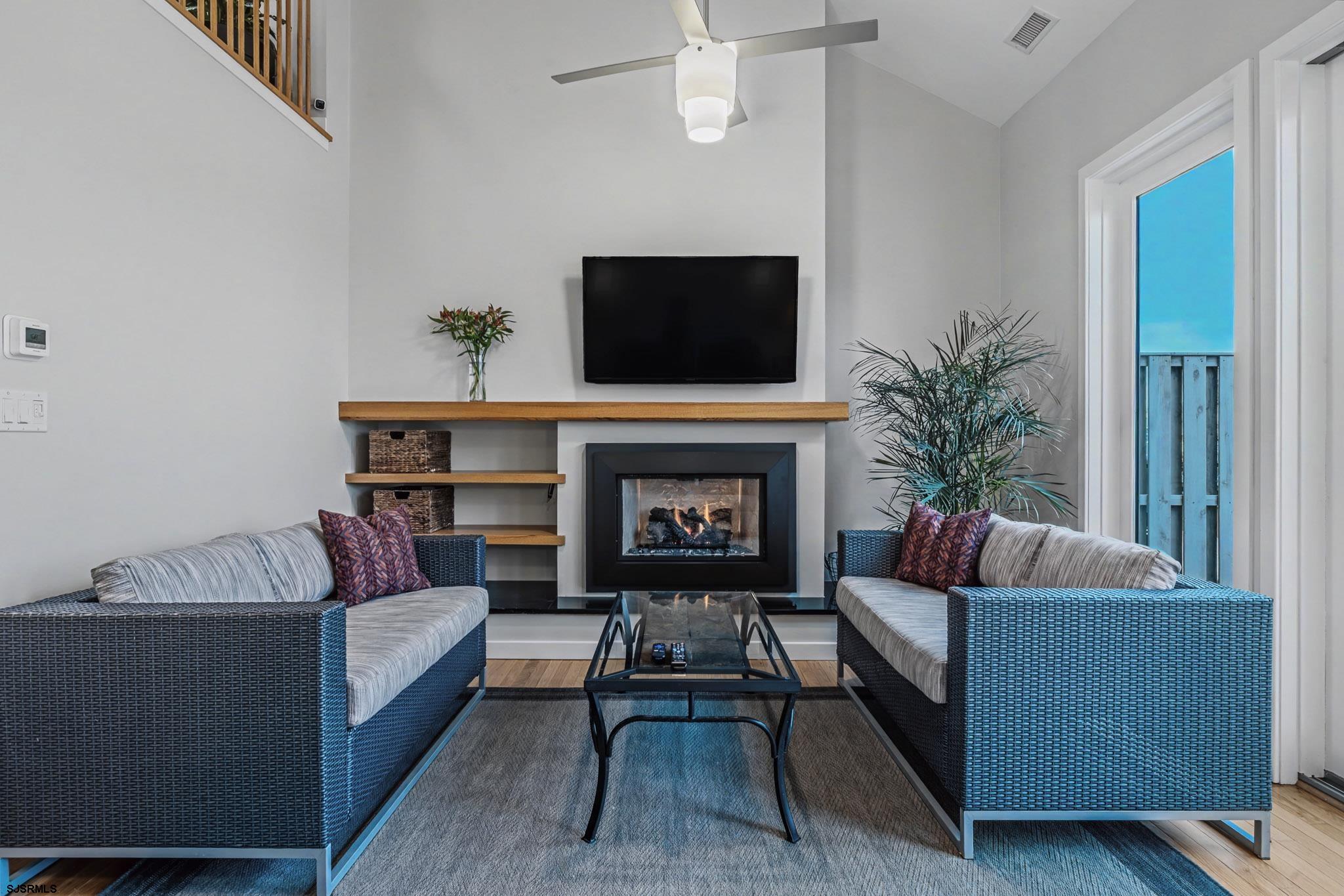 5 Beacon Lane Brigantine, NJ 08203 - Photo 17 of 39 a living room with furniture and a fireplace