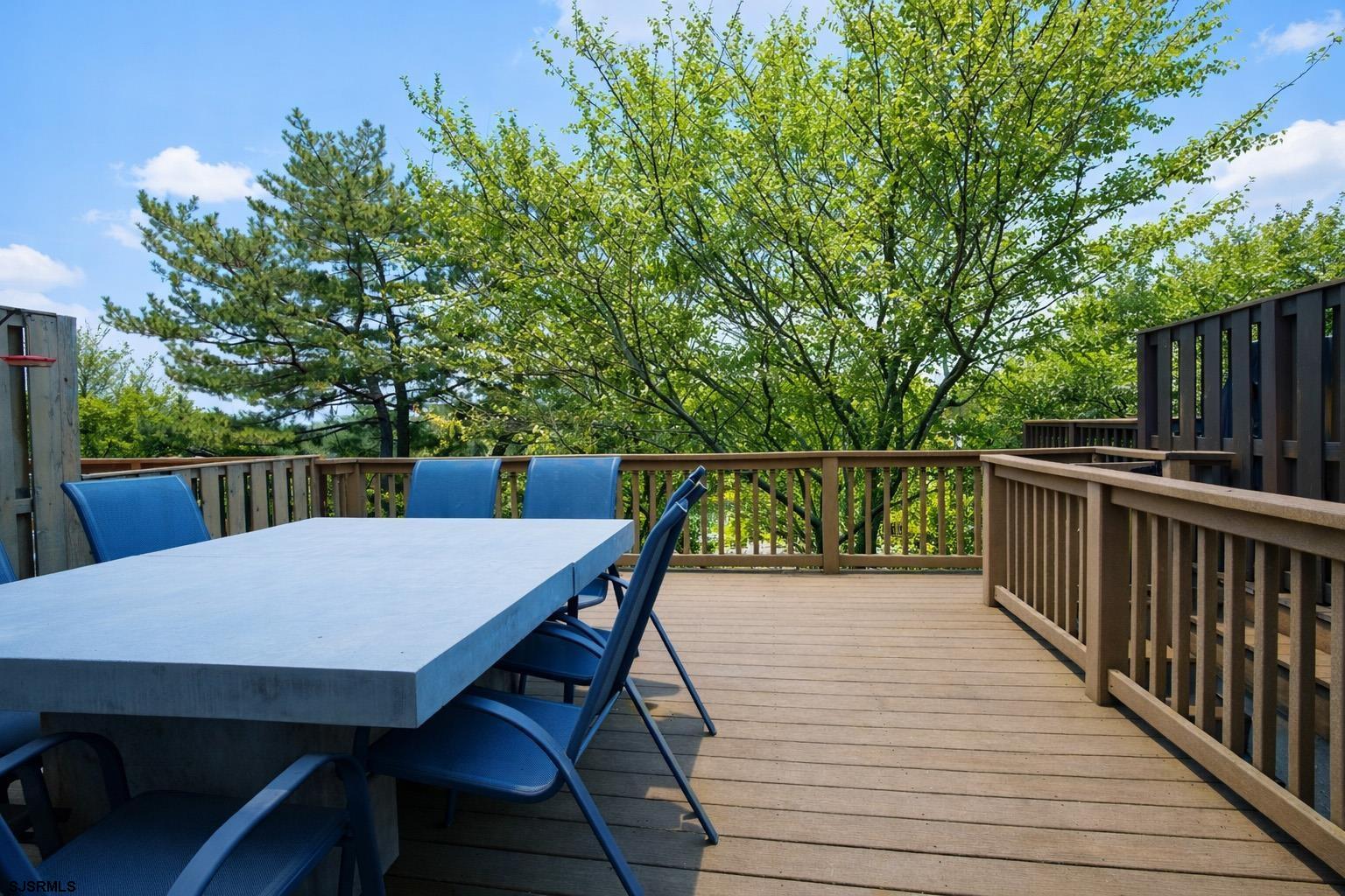 5 Beacon Lane Brigantine, NJ 08203 - Photo 19 of 39 a balcony with wooden floor table and chairs
